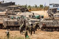မေ ၈ ရက်က အစ္စရေးနိုင်ငံတောင်ပိုင်း ဂါဇာနယ်စပ်အနီးတွင် အစ္စရေးစစ်သားများနှင့် ခြေလျင်တပ် တိုက်ခိုက်ရေးယာဉ်များကို တွေ့ရစဉ်