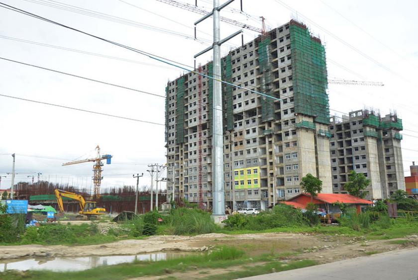 ဒဂုံဆိပ်ကမ်းမြို့နယ်ရှိ တန်ဖိုးနည်းအိမ်ရာ အချို့ကို တွေ့ရစဉ် (ဓာတ်ပုံ-ရှိုင်းလင်းအောင်)